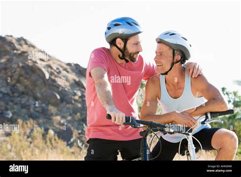 Gay Couple Mountain Biking Together Stock Photo Royalty Free Image