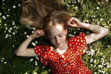 Portrait Of A Beautiful Girl Lying On The Grass Del Colaborador De