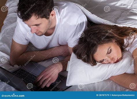 Sleeping Wife And Husband Using Computer Stock Image Image Of Movie Internet 38787579