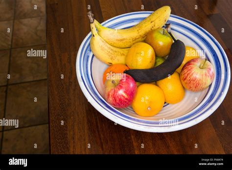 A Bowl Of Fruit In A House With Oranges Pears Apples Bananas Adn