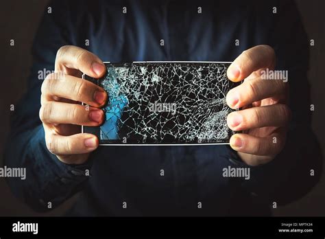 Broken Phone Screen In Hand In Dark Background Guy Breaks A Black