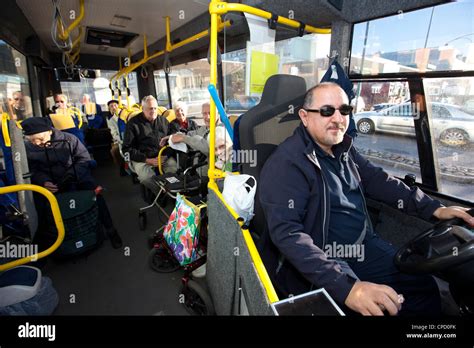 Bus Driver With Passengers Stock Photo Alamy
