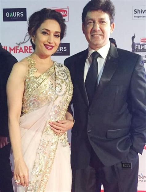 Madhuri Dixit Poses For The Paps With Her Husband Dr Sriram Nene At The