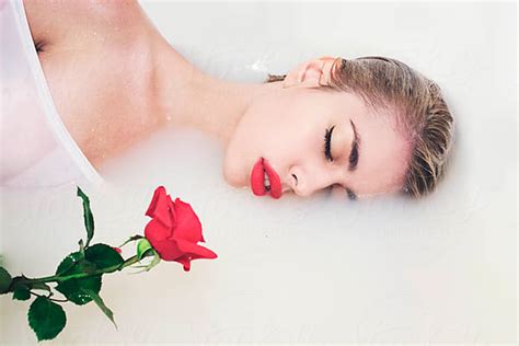 An Attractive Young Woman Lies In Milk Bath With Butterflies By Jovana Rikalo Stocksy United