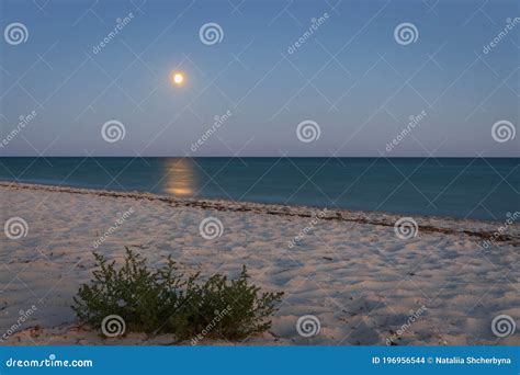 Full Moon With Moonlight On Calm Sea Surface Long Exposure Island