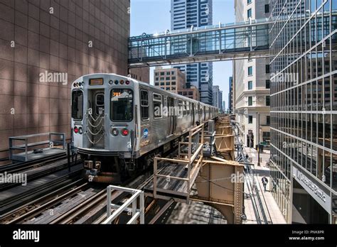 The L Elevated Train Arrives At A Stop In The Loop Downtown Chicago