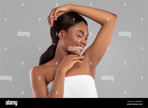 Smiling Millennial African American Woman With Perfect Soft Skin Enjoying Beauty And Results Of