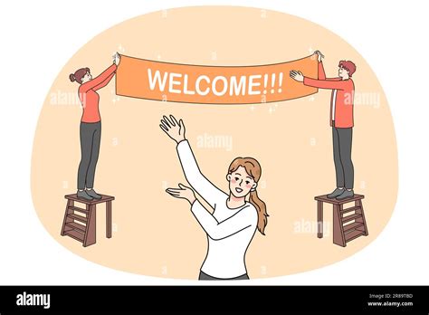 Happy People Hanging Welcome Banner Inviting Visitors To Party Or