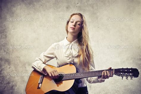 Blonde Beauty Playing Guitar — Stock Photo © Olly18 12848356