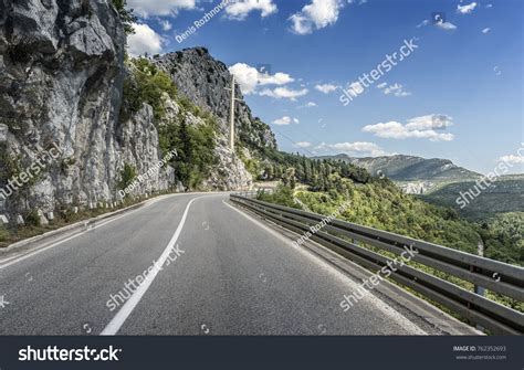 Country Road Through Rocky Mountains Forest Stock Photo 762352693