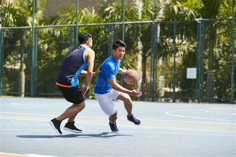 Young Asian Men Playing Basketball Stock Image Image Of Dribbling