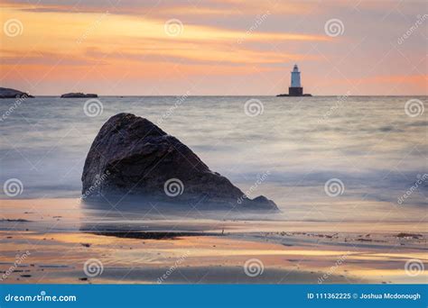 Rocky Coastal Lighthouse Seascape At Sunset Stock Image Image Of