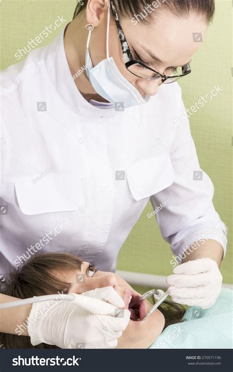 Woman Dentist Treats Teeth Patient Mouth写真素材270571196 Shutterstock