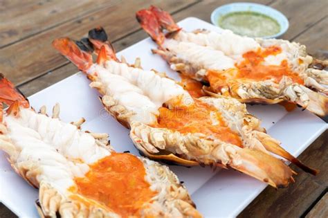 Grilled Giant River Shrimp Or Prawn With Spicy Seafood On Wooden Table