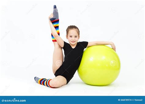 Flexible Teen Girl Doing Gymnastics Exercises On Fitness Ball Stock