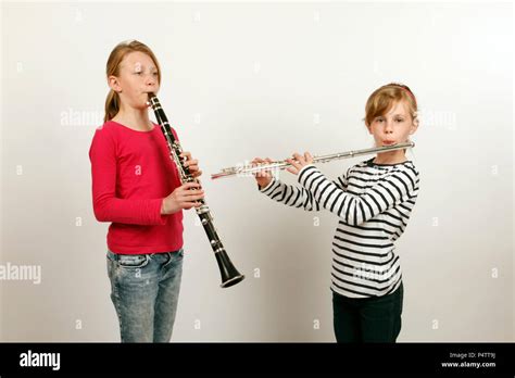 Two Girls Playing A Duet On Clarinet And Flute Stock Photo Alamy
