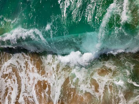 Aerial Photography Of Sea Waves On Seashore During Daytime Photo Free
