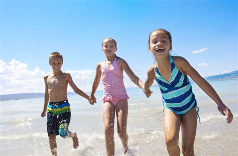 Kids Playing At The Beach Stock Photo Image Of Friendship 25972818