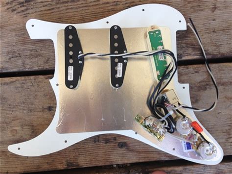 So the original humbucker only got two wires. Pre Wired Stratocaster Pickguard Loaded with Seymour Duncan Everything Axe Black Pearloid