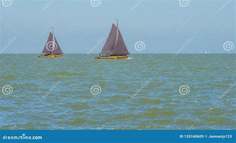 Sailboats Sailing In A Lake Below A Blue Sky Stock Image Image Of