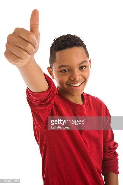 Kid Thumbs Up White Background Photos And Premium High Res Pictures