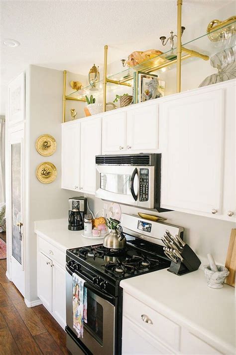 30 Ways To Decorate Above Kitchen Cabinets