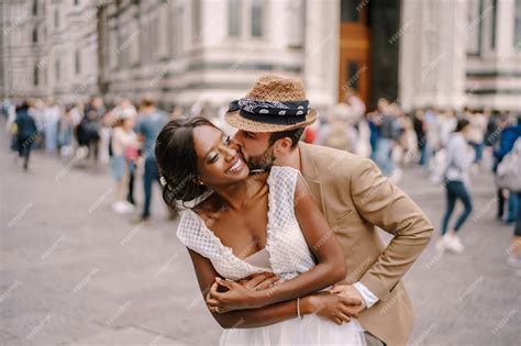 premium photo mixed race wedding couple wedding in florence italy caucasian groom hugs from