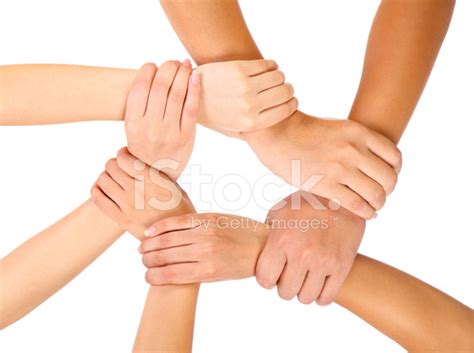 Three People Holding Wrists Showing Unity Stock Photos