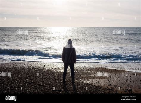 Woman Looking Out To Sea Stock Photo Alamy
