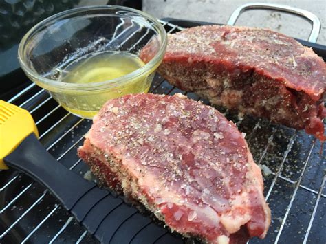 Rest for about 5 minutes, then top each steak with a dollop of herbed butter. Filet Mignon on a cast iron skillet — Big Green Egg ...
