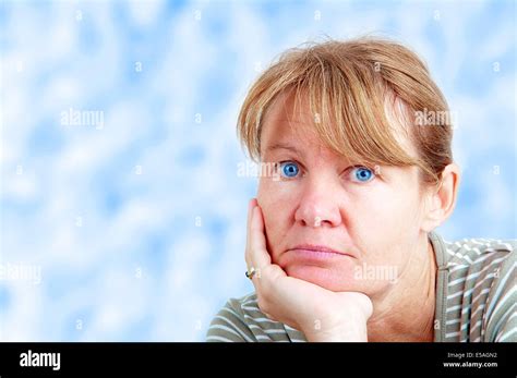 Bored Woman Looking Into The Camera Stock Photo Alamy