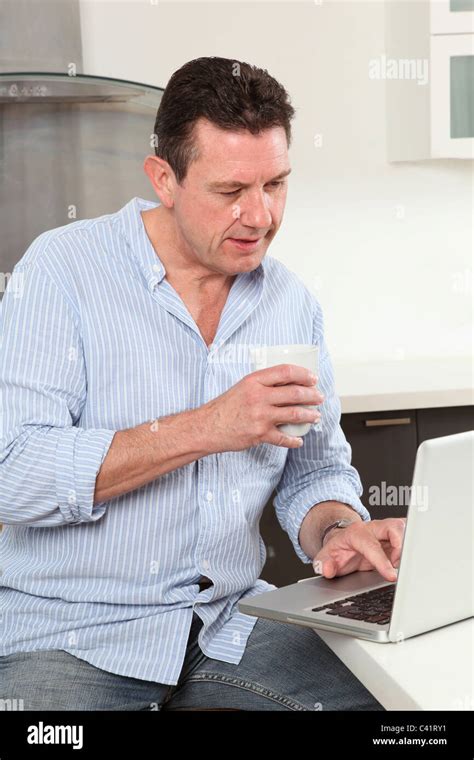 Man Working From Home Using A Laptop Stock Photo Alamy