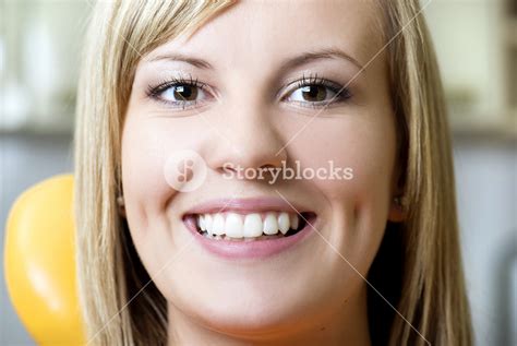 Beautiful Girl Is Showing Her White Teeth At Dentist Royalty Free Stock