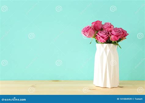 Romantic Bouquet Of Pink Roses In The Vase Over Wooden Table Stock