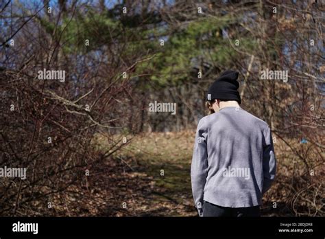Boy Walking In Woods Stock Photo Alamy