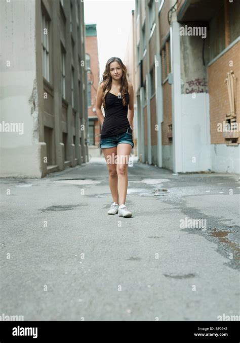 Teenage Girl Walking In The Street Stock Photo Alamy