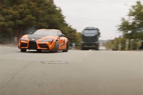 The orange current generation toyota gr supra wears a black v detail on its hood and is designed to. The cars of Fast & Furious 9