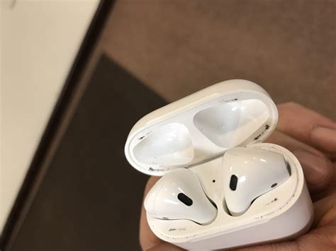 Metal shavings stuck to Airpods case - Apple Community