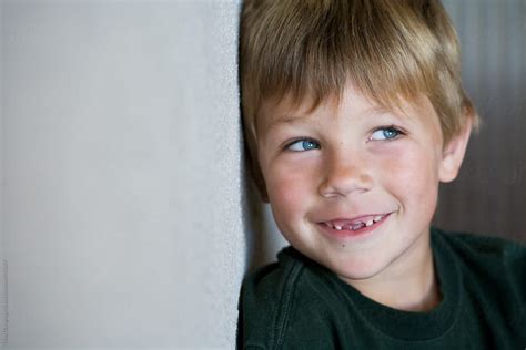 Little Boy Smiling With Missing Front Teeth By Stocksy Contributor