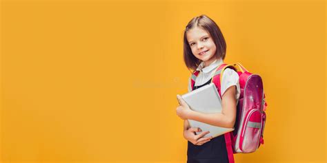 Cute Schoolgirl Preparing To Go To School With Backpack And Tablet Back To School Concept Stock