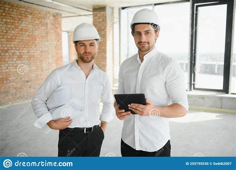 Two Young Man Architect On A Building Construction Site Stock Photo