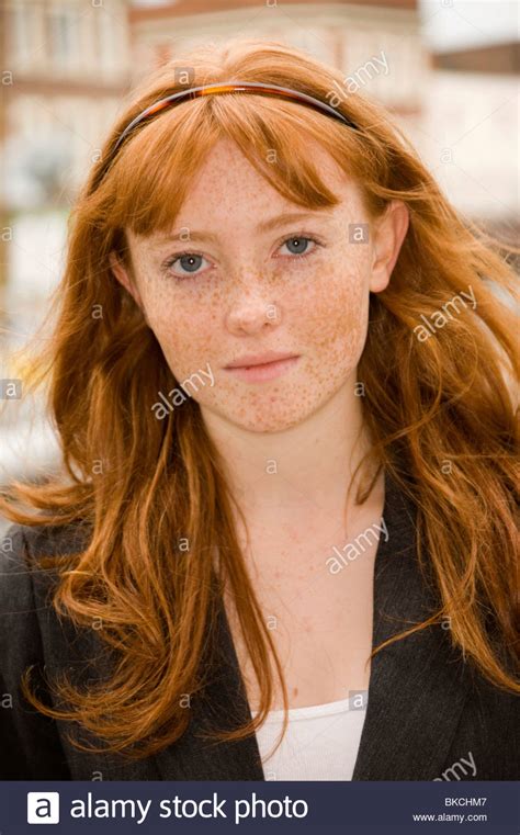 Portrait Of A Teenage Girl With Red Hair Blue Eyes And