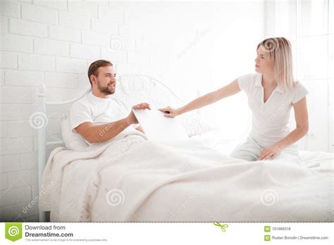Sensual Young Couple Together In Bed. Angry Couple In Bedroom On A White Background. Stock Photo ...