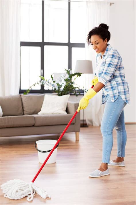 African Woman Or Housewife Cleaning Floor At Home Stock Photo Image