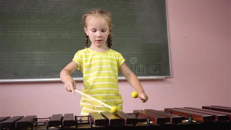 A Little Girl Plays The Xylophone In A Music Class Stock Video Video