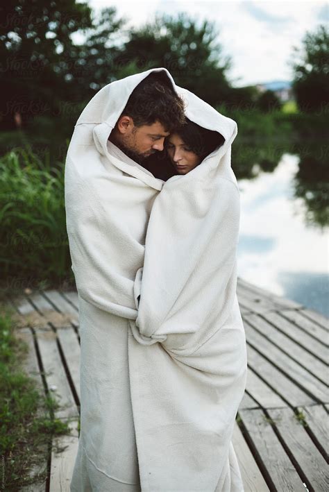 Couple Wrapped In Blanket Outdoors By Stocksy Contributor Simone