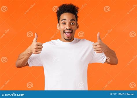 Amused And Excited Happy African American Guy Showing Thumbs Up And