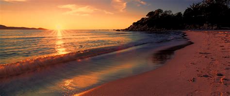 2560x1080 Sea Sunset Beach Sunlight Long Exposure 4k Wallpaper