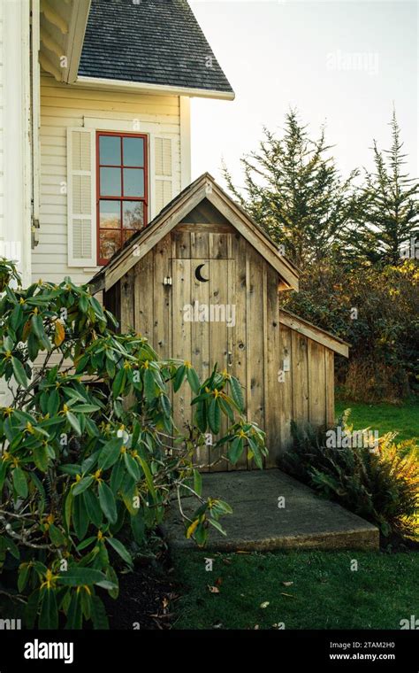 Outhouse With Moon Cutout Symbol By Old Building Stock Photo Alamy