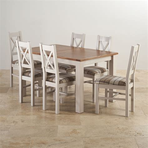 Besides traditional rectangular designs, you'll find round, oval, and square options. Rustic solid oak and painted dining set with six chairs.